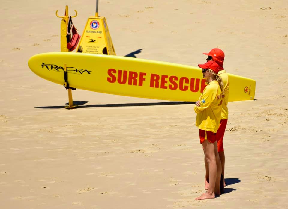 man and woman lifesavers patrolling beach