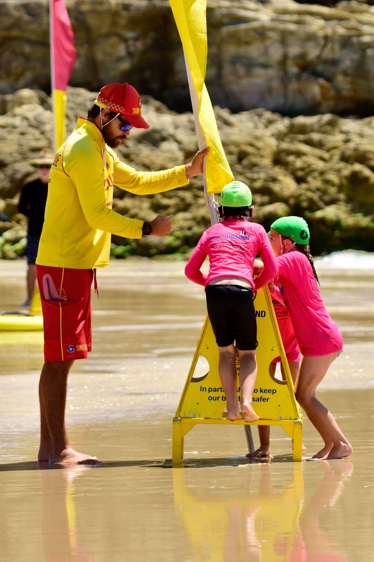 lifesaver supervising nippers at point lookout surf lifesaving club