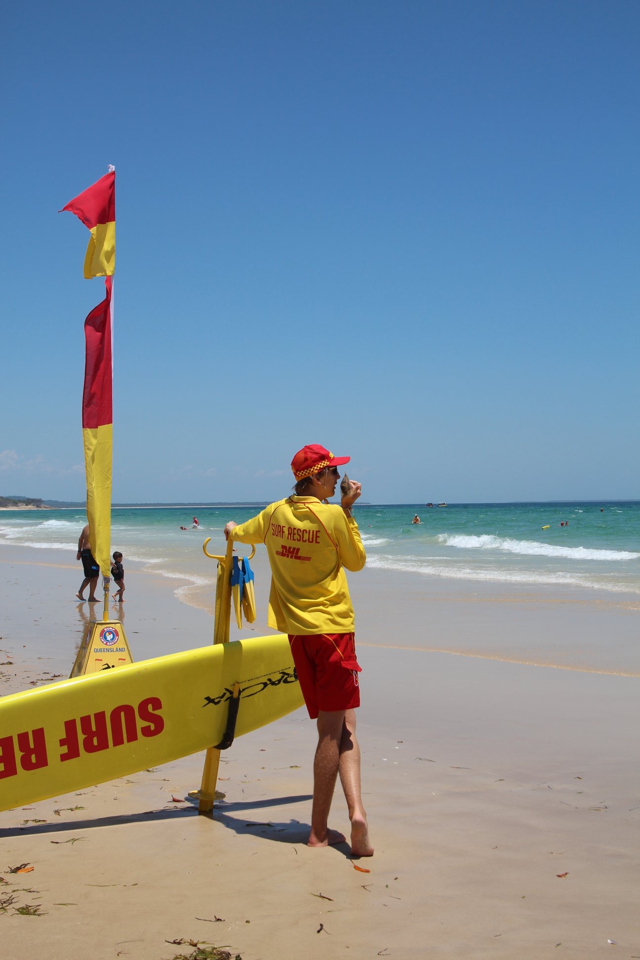 lifesaver standing on beach